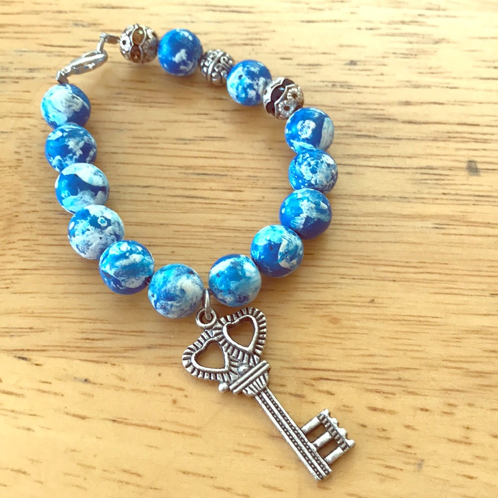 New earth globe bracelet with key